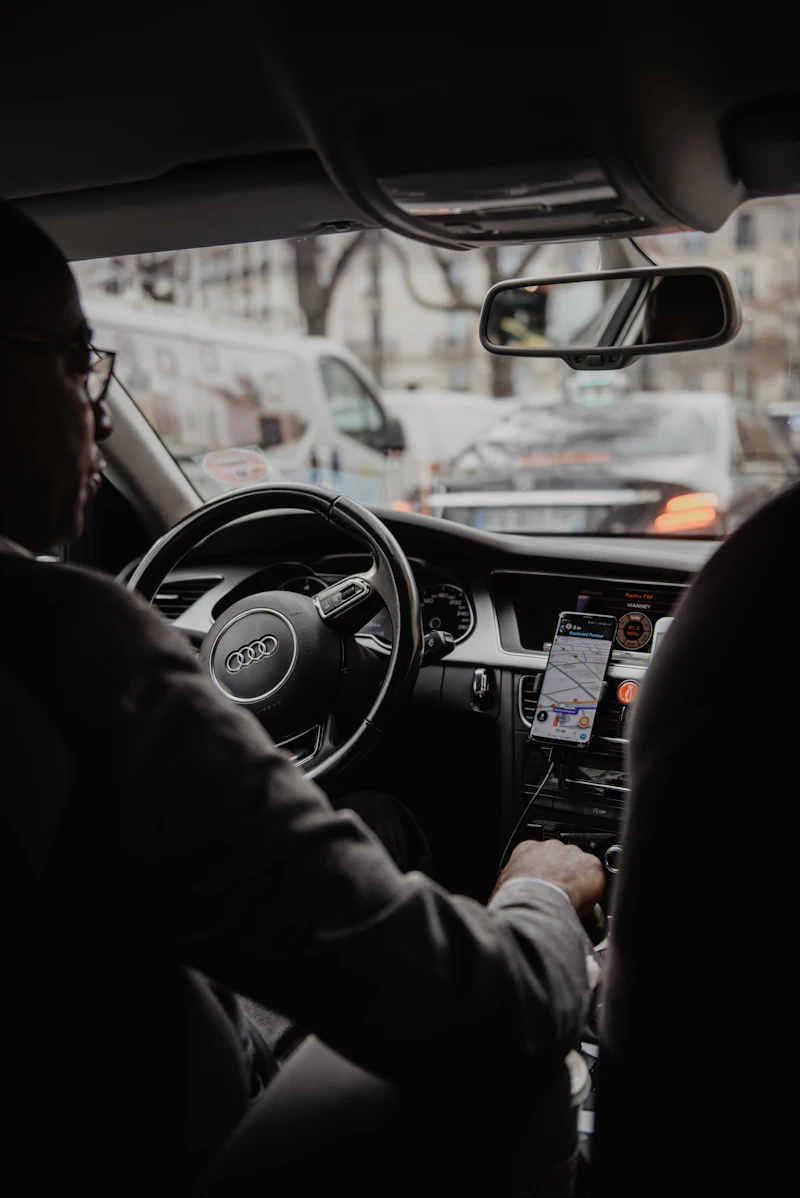 Professional taxi driver at the wheel with sat-nav running